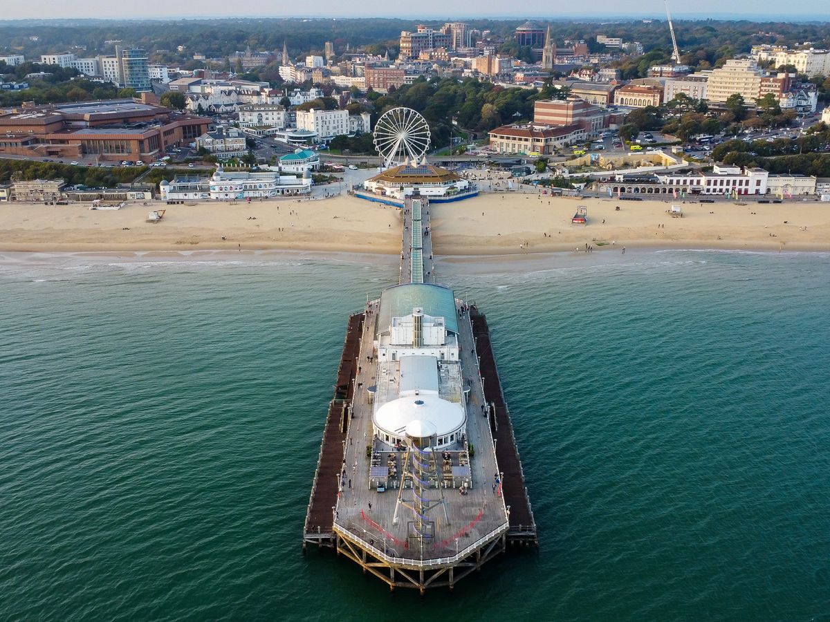 Aerial view of a seaside pier and beach
